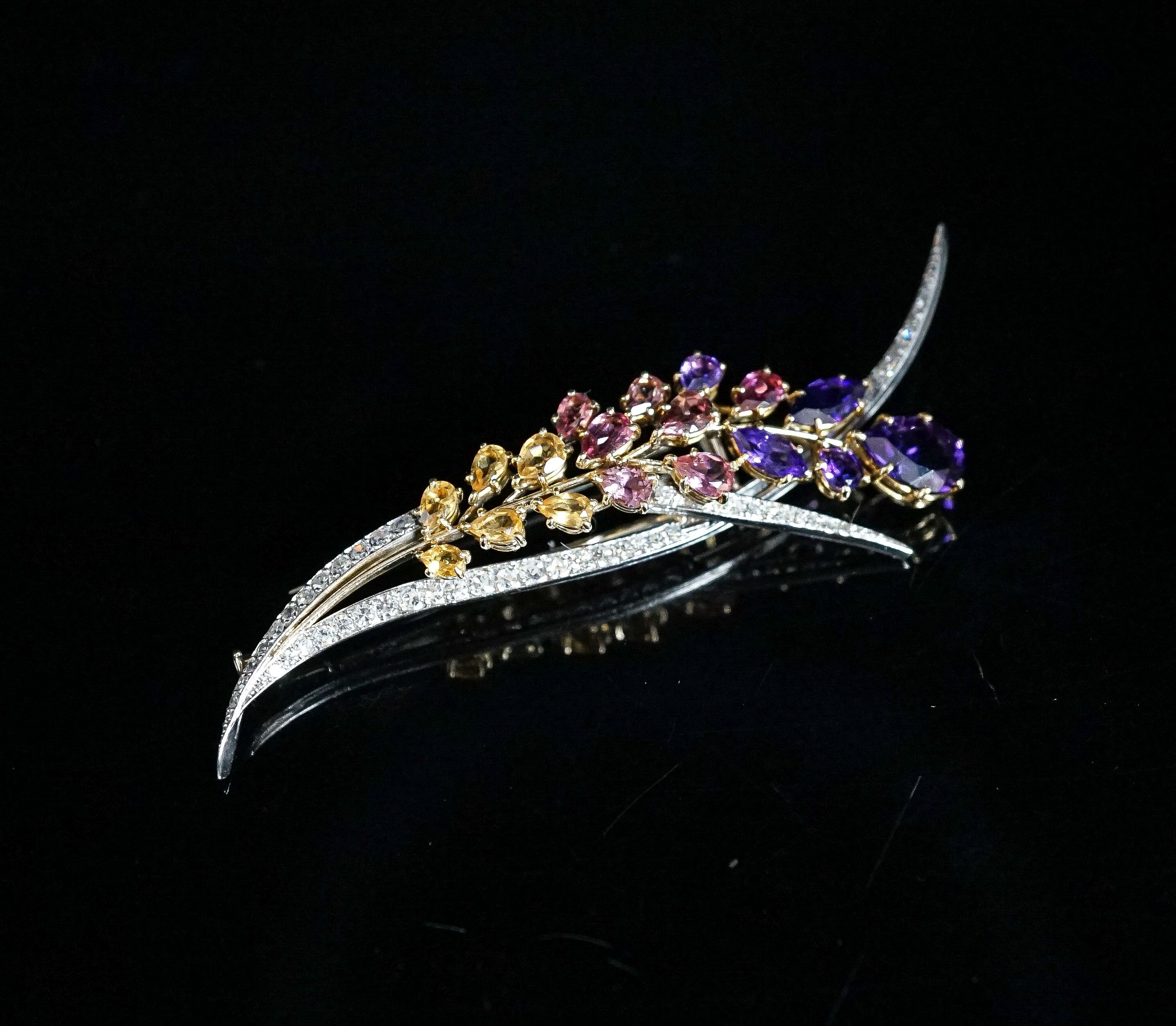 A French 18ct white metal, diamond and multi gem set floral spray brooch, 85mm, gross 17.4 grams.
